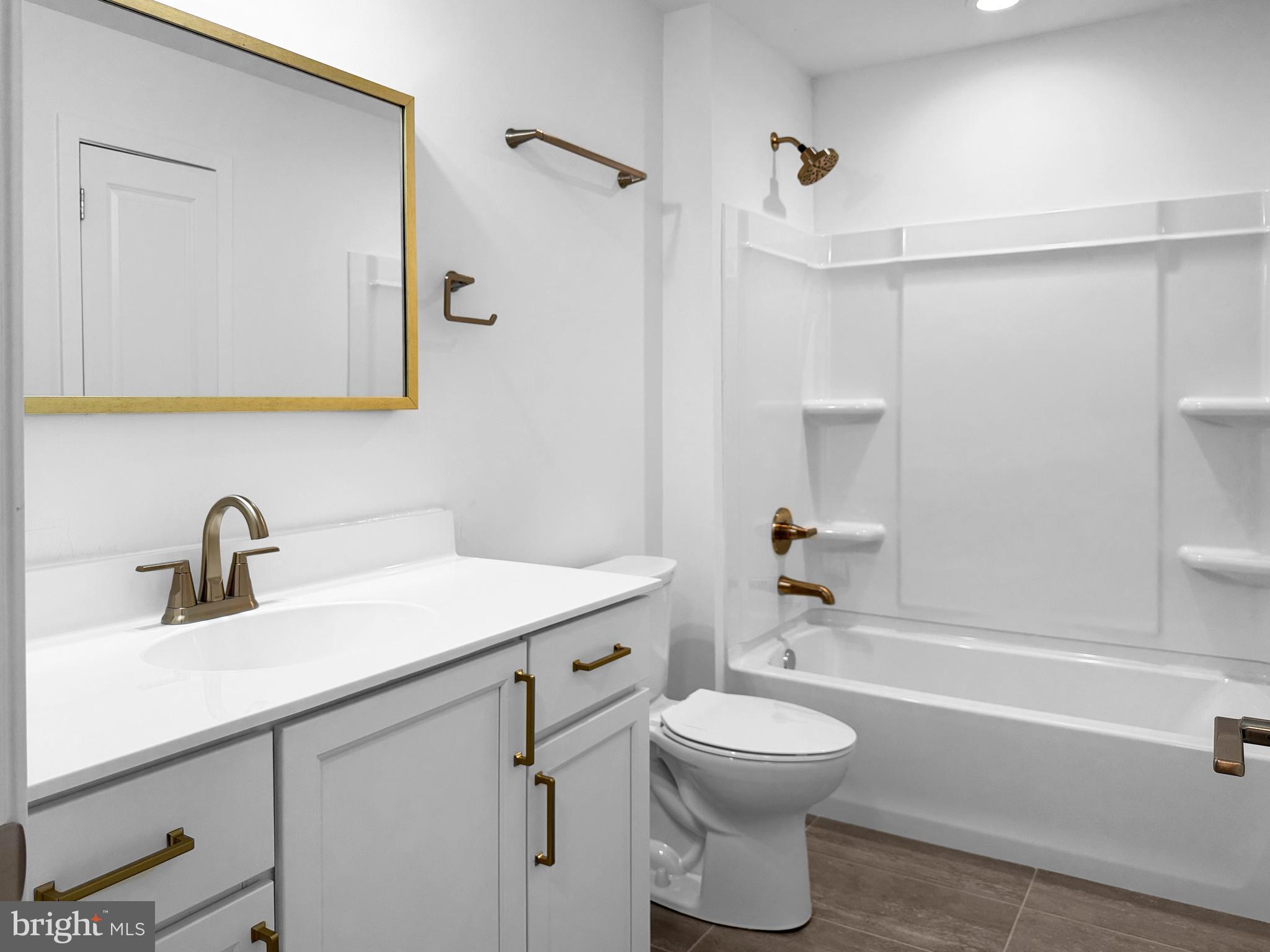 11 West Butler Avenue New Britain, PA 18901 - Photo 26 of 42 a bathroom with a sink a toilet and shower