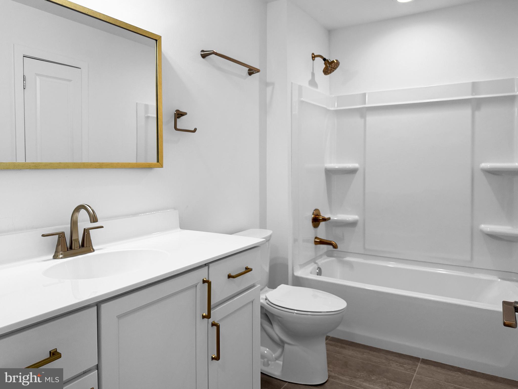 11 West Butler Avenue New Britain, PA 18901 - Photo 27 of 42 a bathroom with a sink a toilet and shower