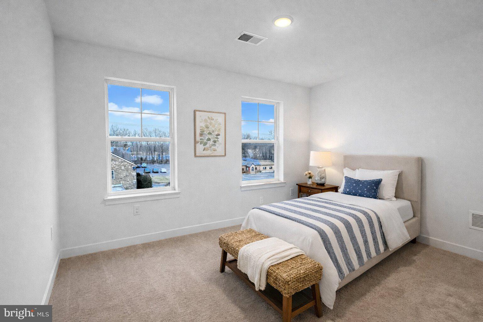 11 West Butler Avenue New Britain, PA 18901 - Photo 30 of 42 a bedroom with a bed and a window