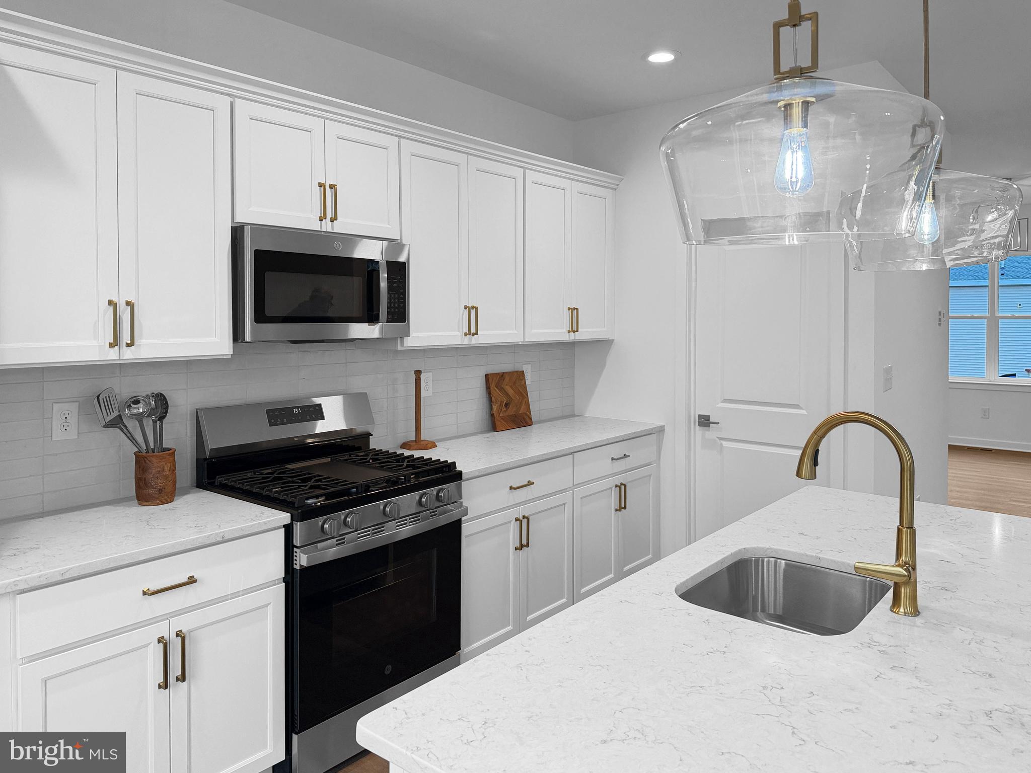 11 West Butler Avenue New Britain, PA 18901 - Photo 9 of 42 a kitchen with white cabinets a sink and appliances