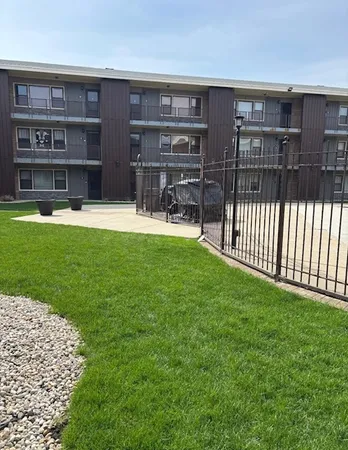 a view of a house with backyard and porch