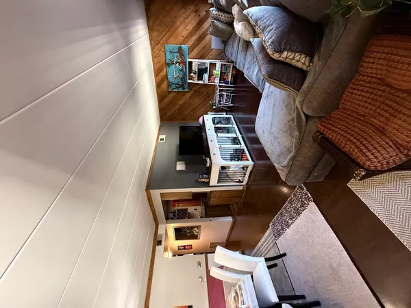 a view of wooden floor and windows in an empty room