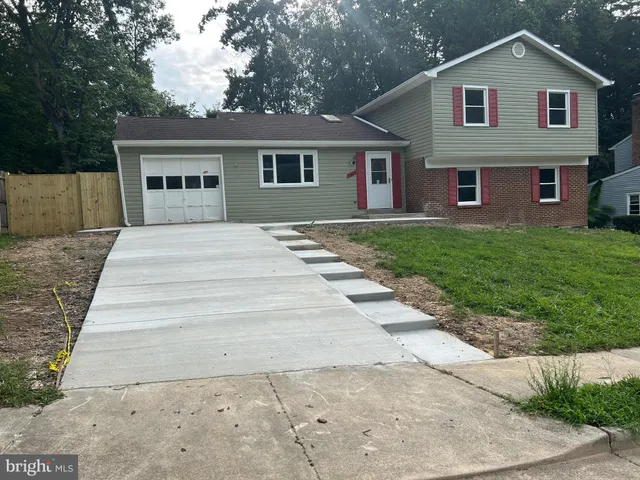 a view of a yard in front view of a house