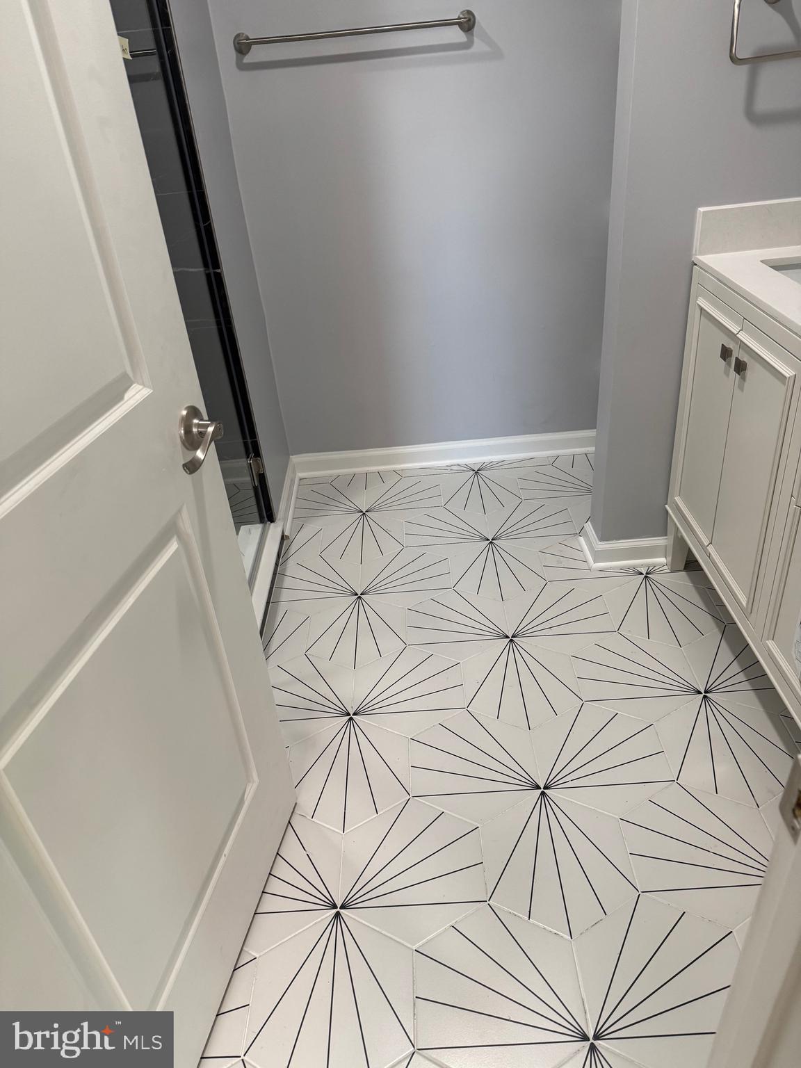 7810 Newington Woods Drive Springfield, VA 22153 - Photo 11 of 50 a view of a room with racks on the wall