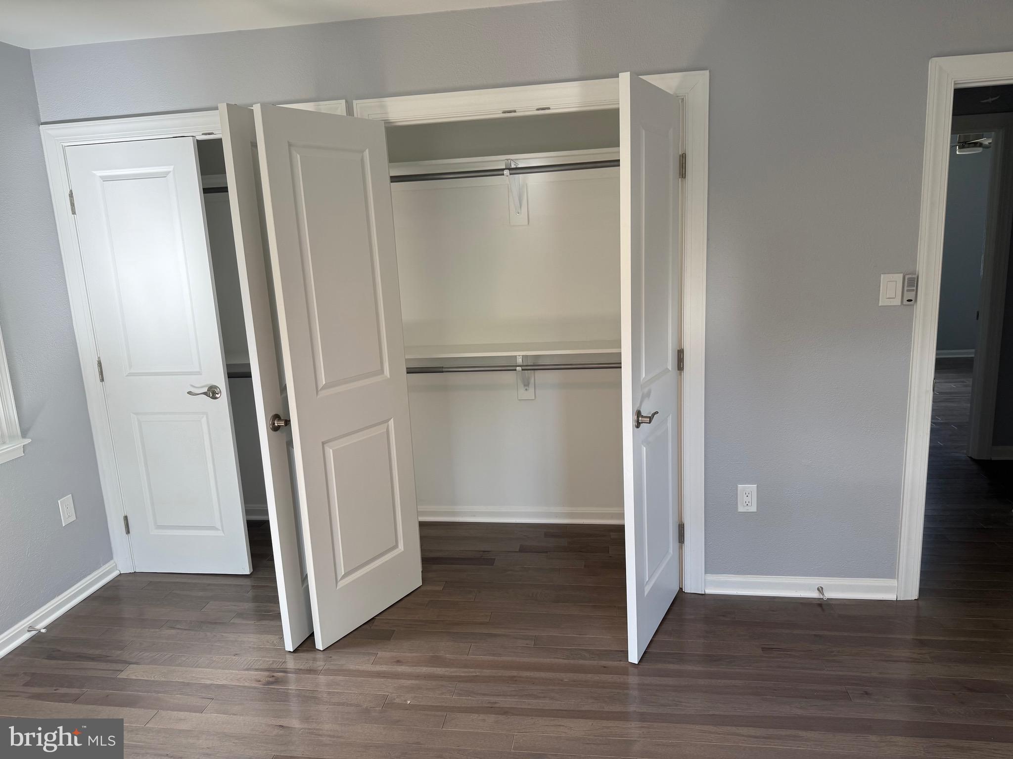 7810 Newington Woods Drive Springfield, VA 22153 - Photo 15 of 50 a view of an empty room with wooden floor and a window