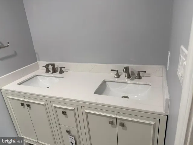 a bathroom with a sink and a washing machine