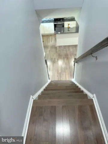 a view of staircase with kitchen