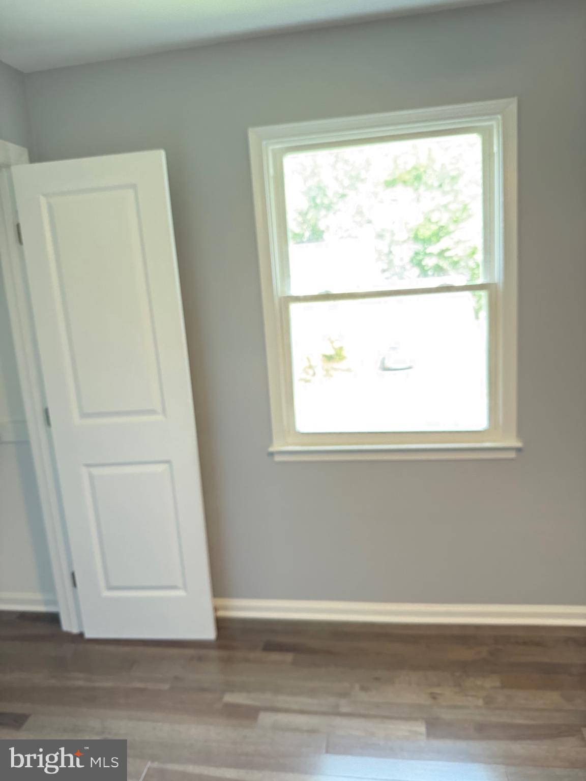7810 Newington Woods Drive Springfield, VA 22153 - Photo 31 of 50 a view of a small space with wooden floor and a window
