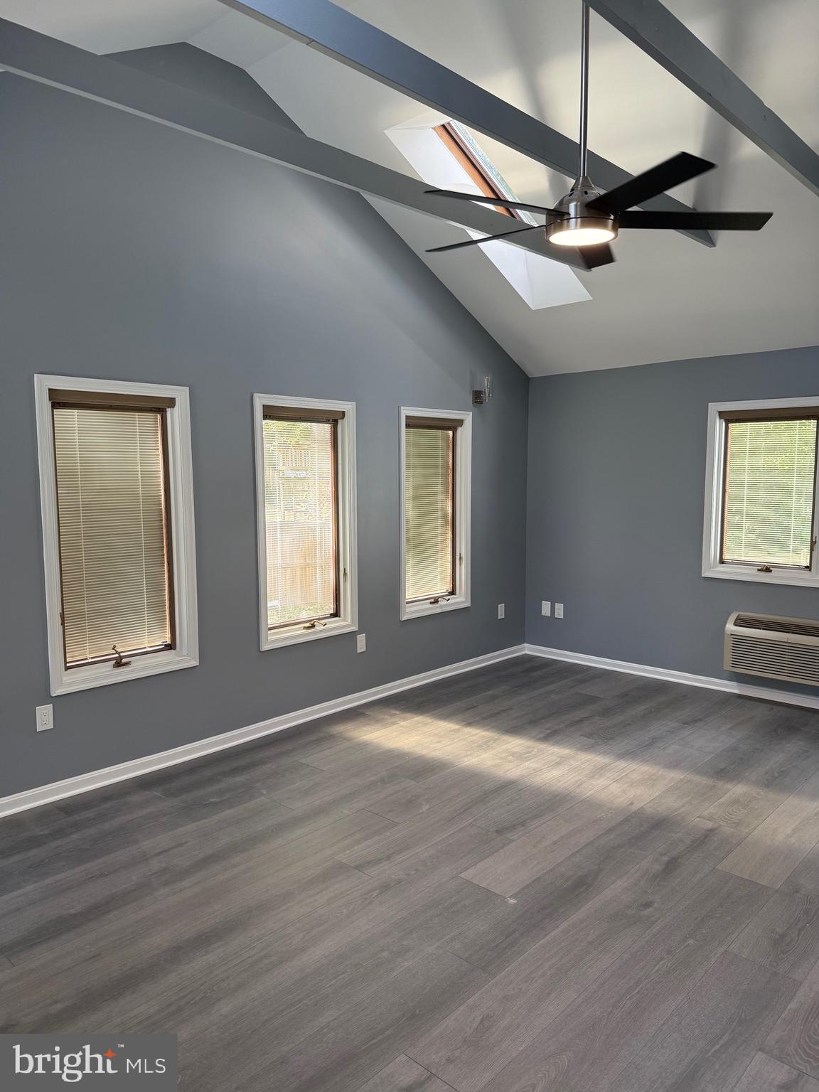 7810 Newington Woods Drive Springfield, VA 22153 - Photo 38 of 50 a view of an empty room with a window and wooden floor