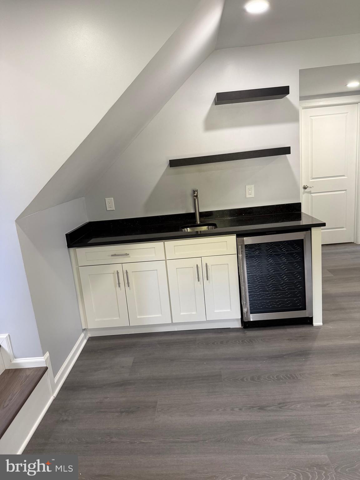 7810 Newington Woods Drive Springfield, VA 22153 - Photo 43 of 50 a kitchen with granite countertop a stove and a sink