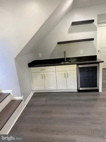 a kitchen with a sink and a stove