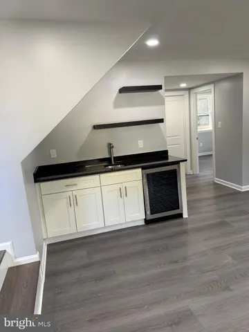 a kitchen with a sink and a stove