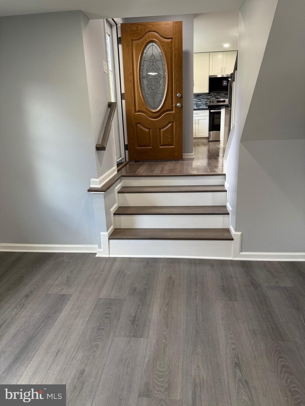 7810 Newington Woods Drive Springfield, VA 22153 - Photo 6 of 50 a view of a hallway with wooden floor