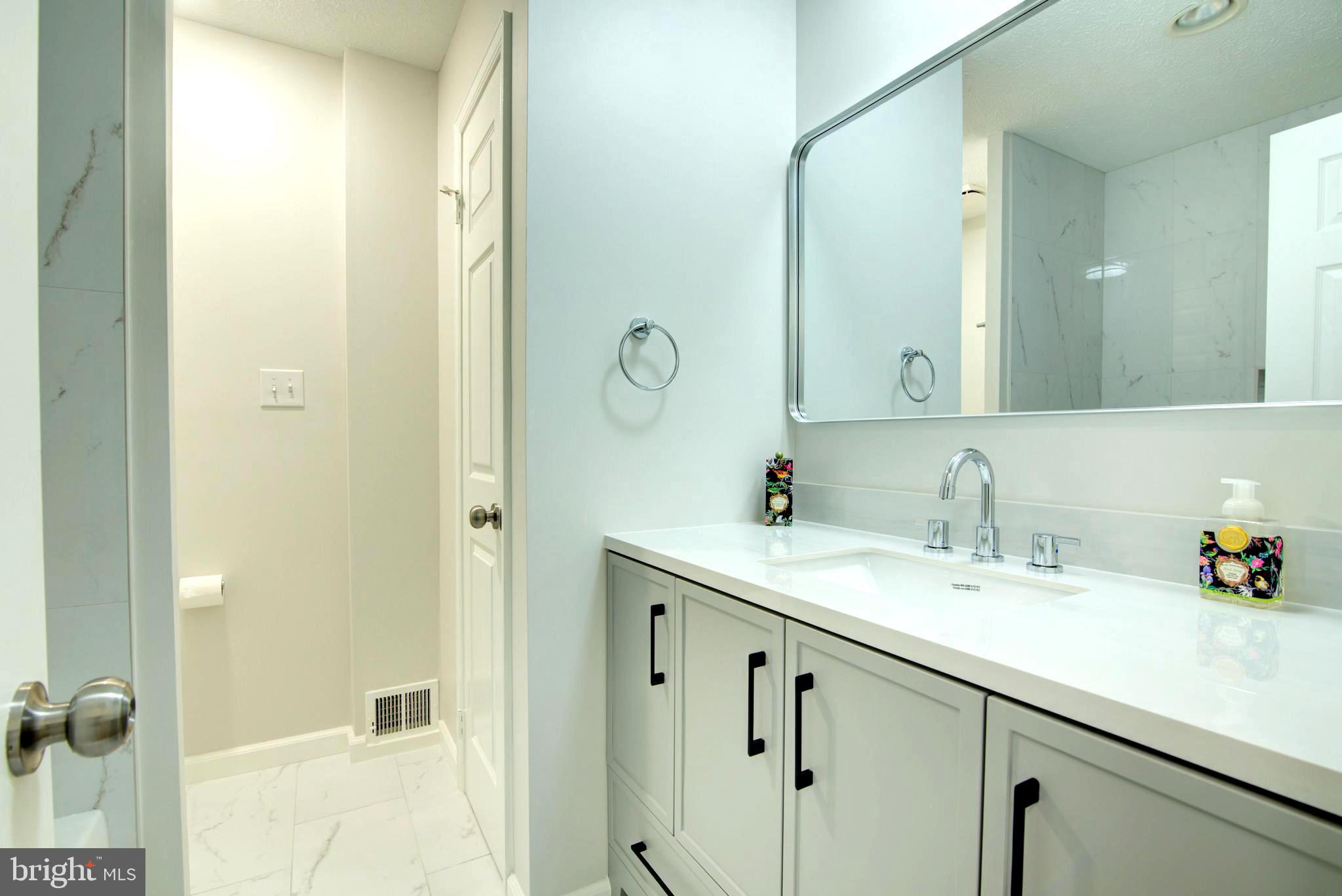 44 Carrollton Road Sterling, VA 20165 - Photo 45 of 72 Upper hall bath - new vanity w/ quartz counter top