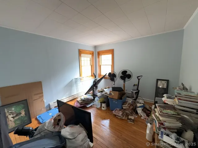 a room with furniture and wooden floor