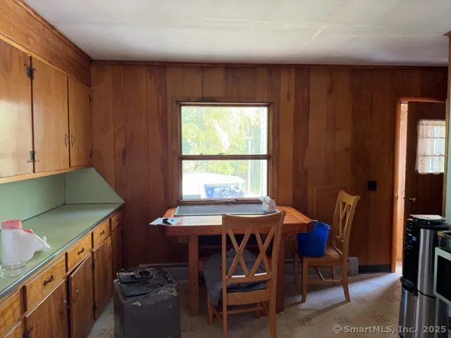 a view of a dining room with furniture window and outside view