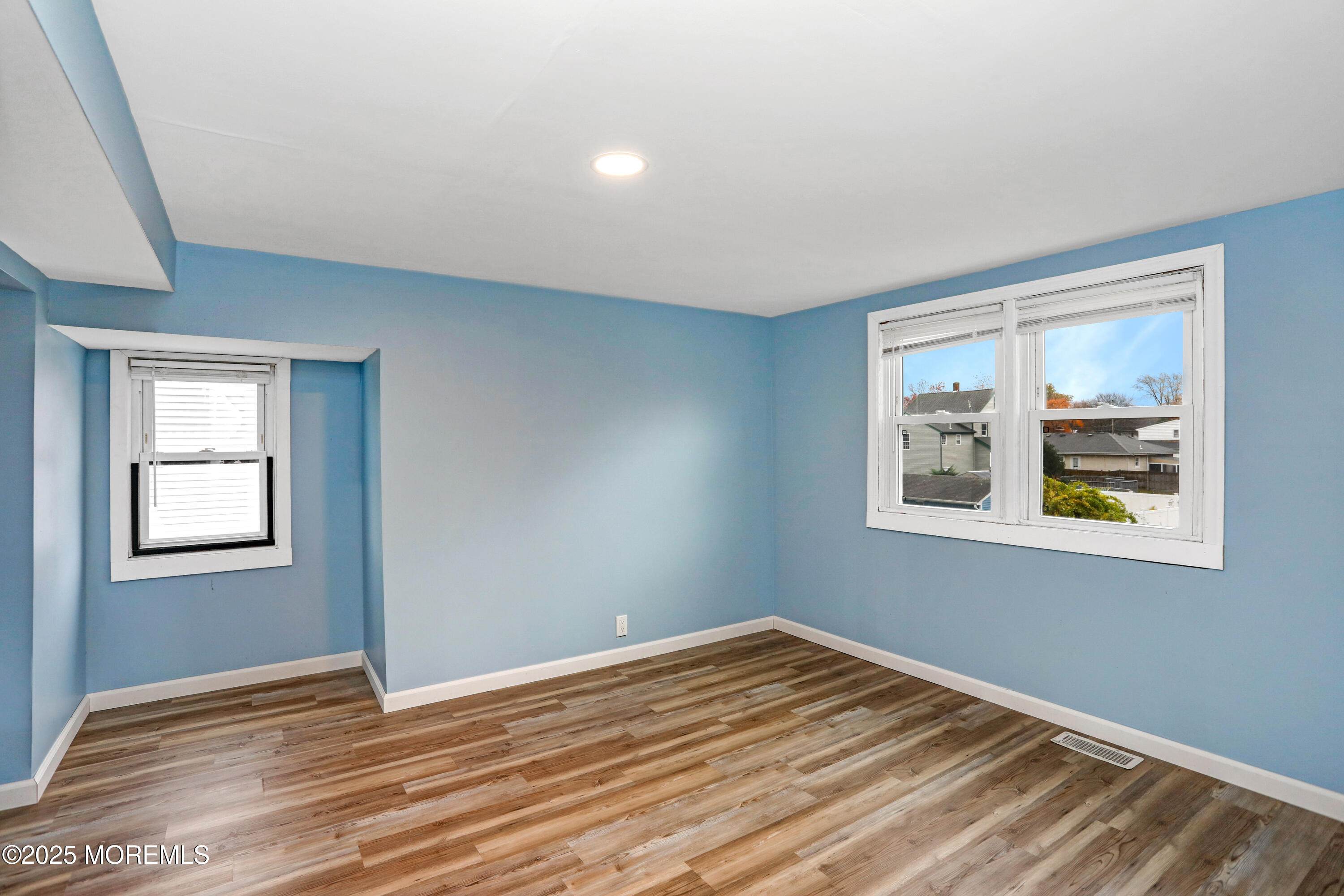 120 Victoria Place Union Beach, NJ 07735 - Photo 12 of 18 a view of empty room with window and wooden floor