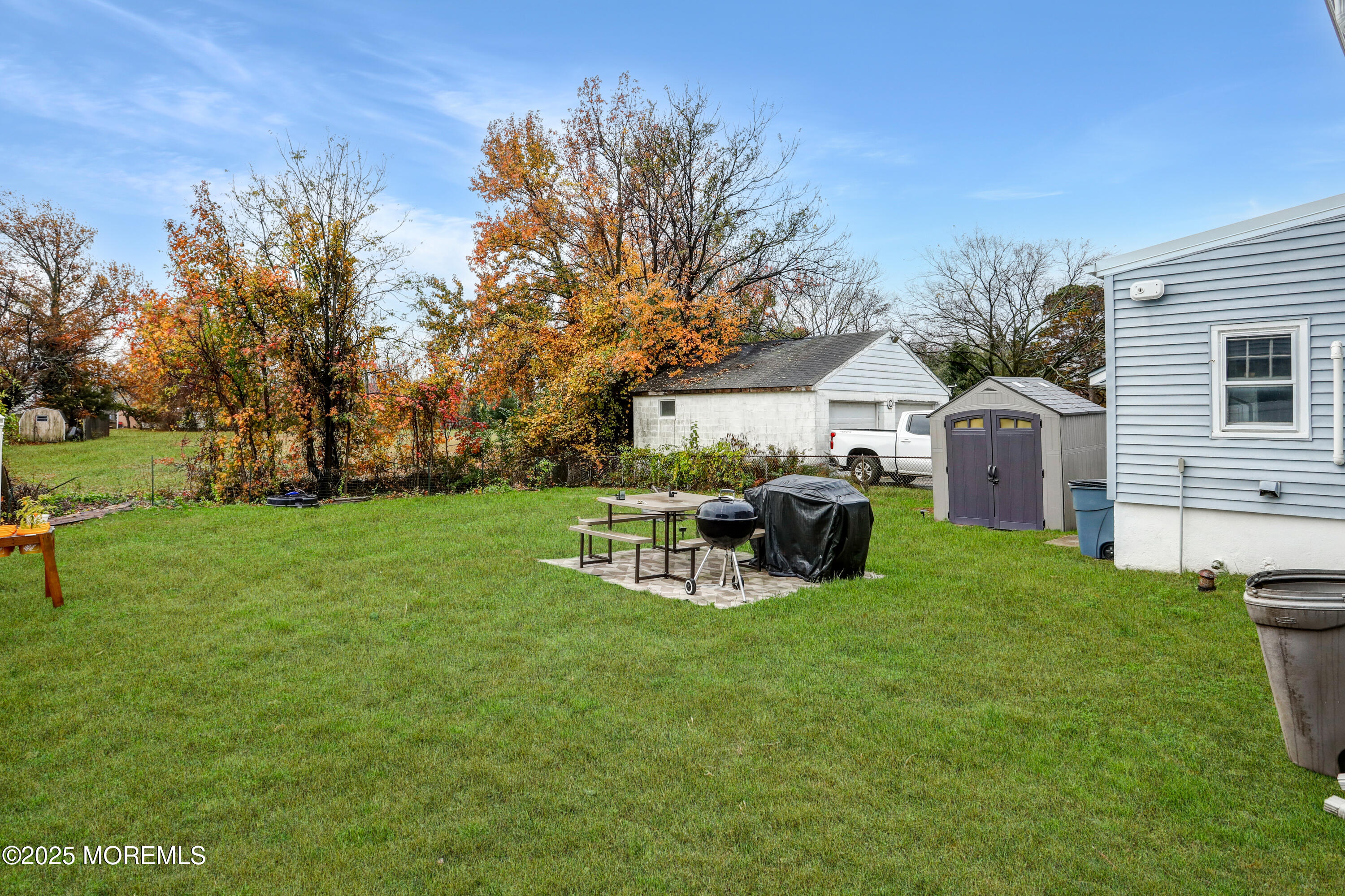 120 Victoria Place Union Beach, NJ 07735 - Photo 17 of 18 a view of a house with backyard and sitting area