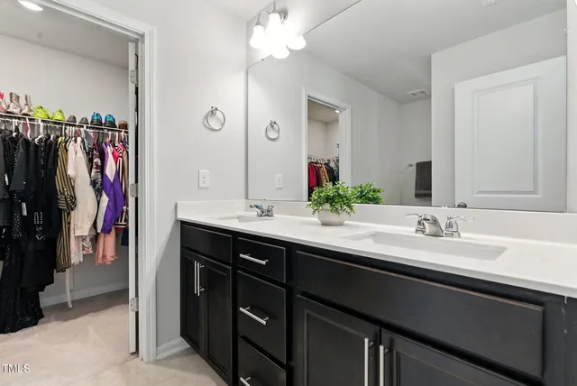a bathroom with a shower and a sink