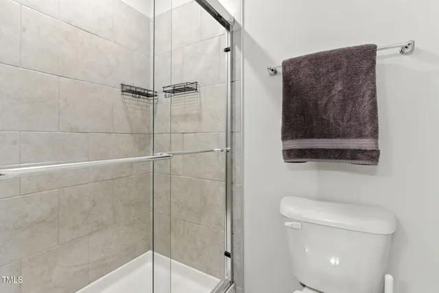 a view of a livingroom with workspace and a window