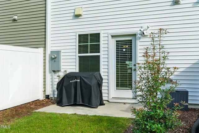 an aerial view of a house with a big yard