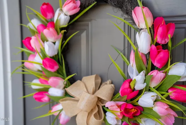 a couple of people sitting in front of a house