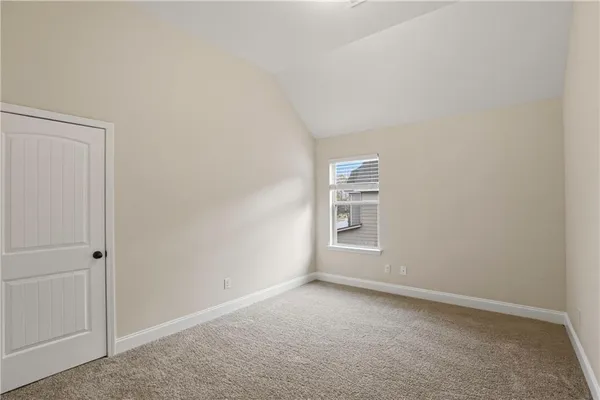 a view of an empty room and a window