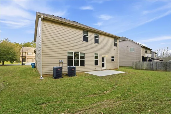 a view of a field with an trees