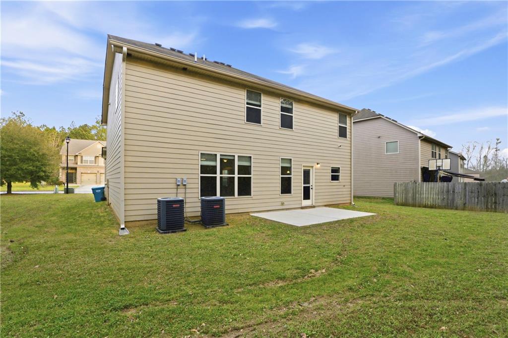 1423 Stone Ridge Court Hampton, GA 30228 - Photo 21 of 22 a front view of a house with a garden