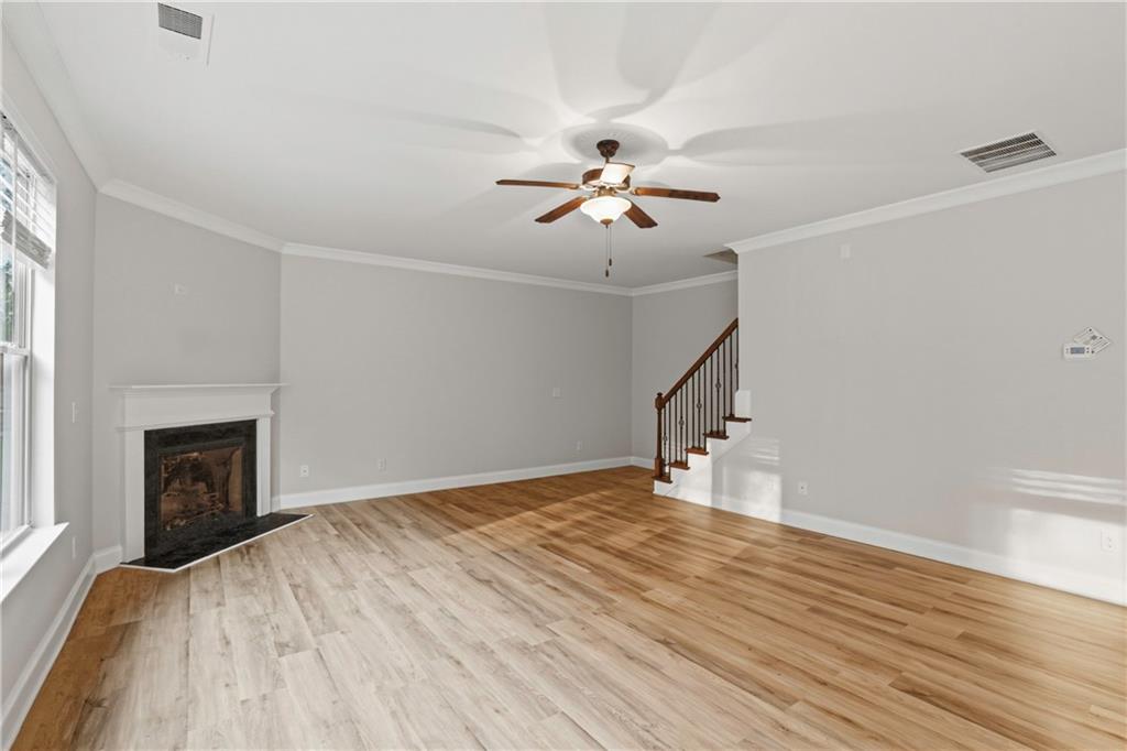 1423 Stone Ridge Court Hampton, GA 30228 - Photo 4 of 22 a view of empty room with wooden floor and fan