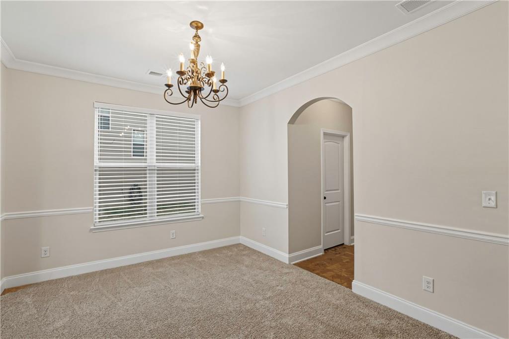 1423 Stone Ridge Court Hampton, GA 30228 - Photo 10 of 22 an empty room with windows and fan