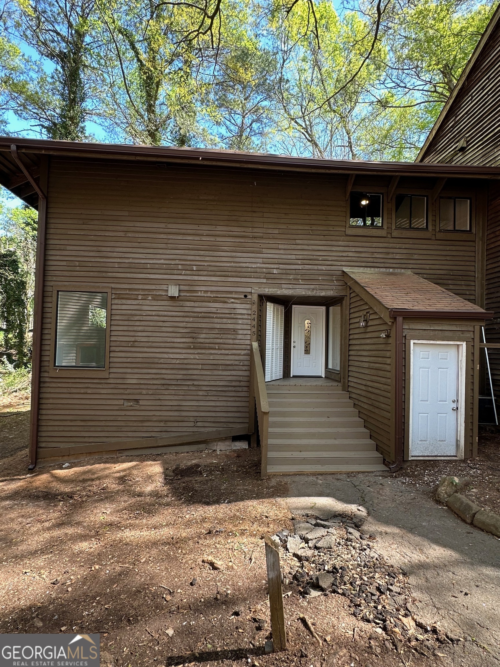 a front view of a house with garage