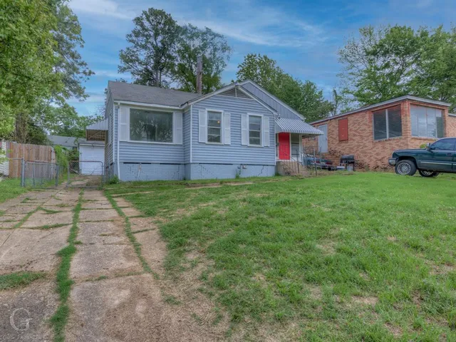 a house view with a garden space