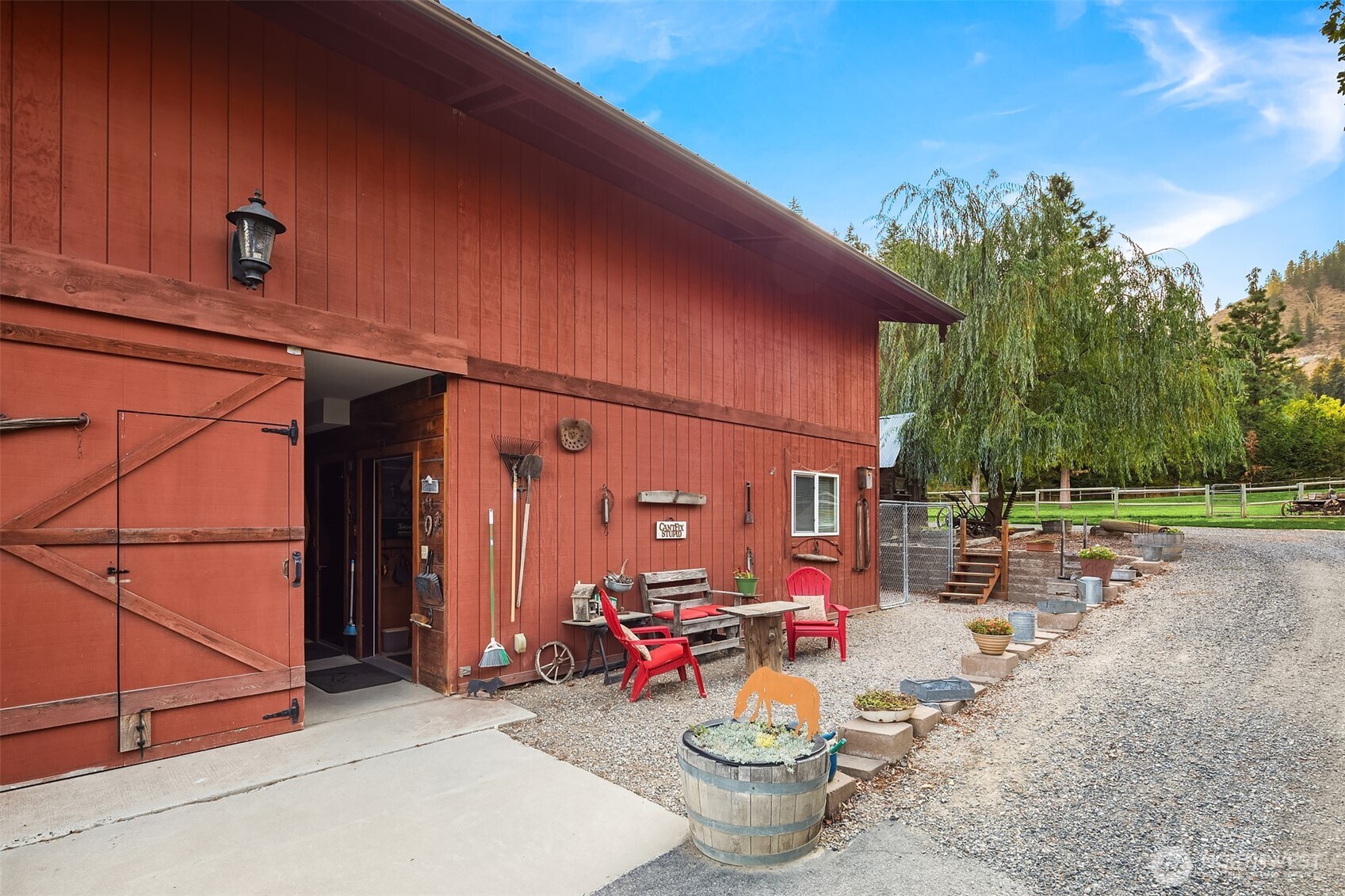 951 Willems Road Cashmere, WA 98815 - Photo 34 of 40 a view of a backyard with table and chairs and potted plants