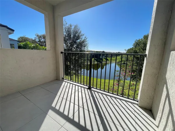 a view of balcony with wooden floor and fence