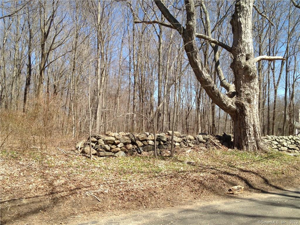 82 Quarry Hill Road Haddam, CT 06424 - Photo 1 of 1 a view of a wooden house with a bench