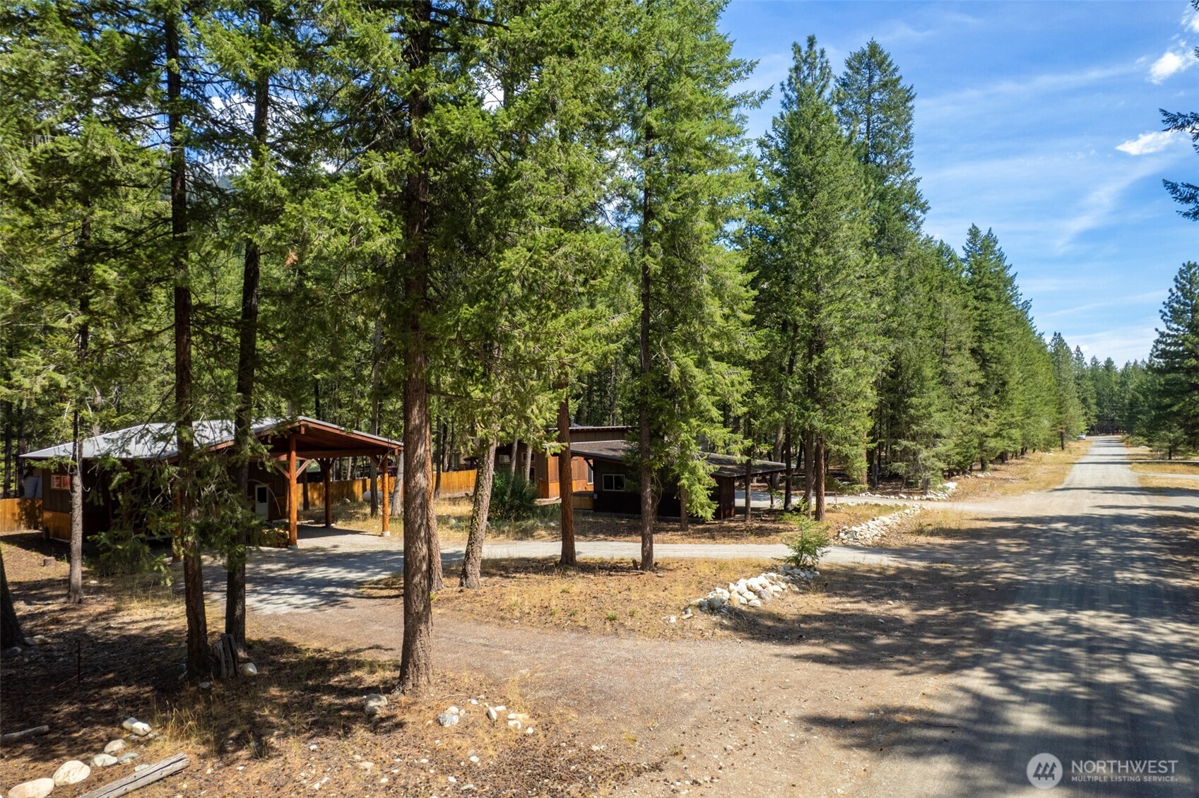 16 Littell Road Mazama, WA 98833 - Photo 19 of 40 a front view of a house with a tree