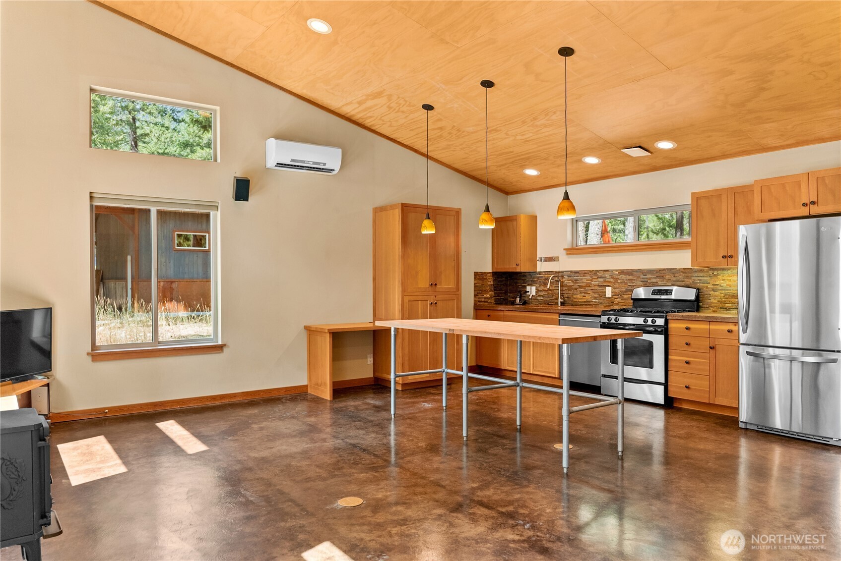16 Littell Road Mazama, WA 98833 - Photo 30 of 40 a kitchen with stainless steel appliances granite countertop a refrigerator a stove top oven and a refrigerator