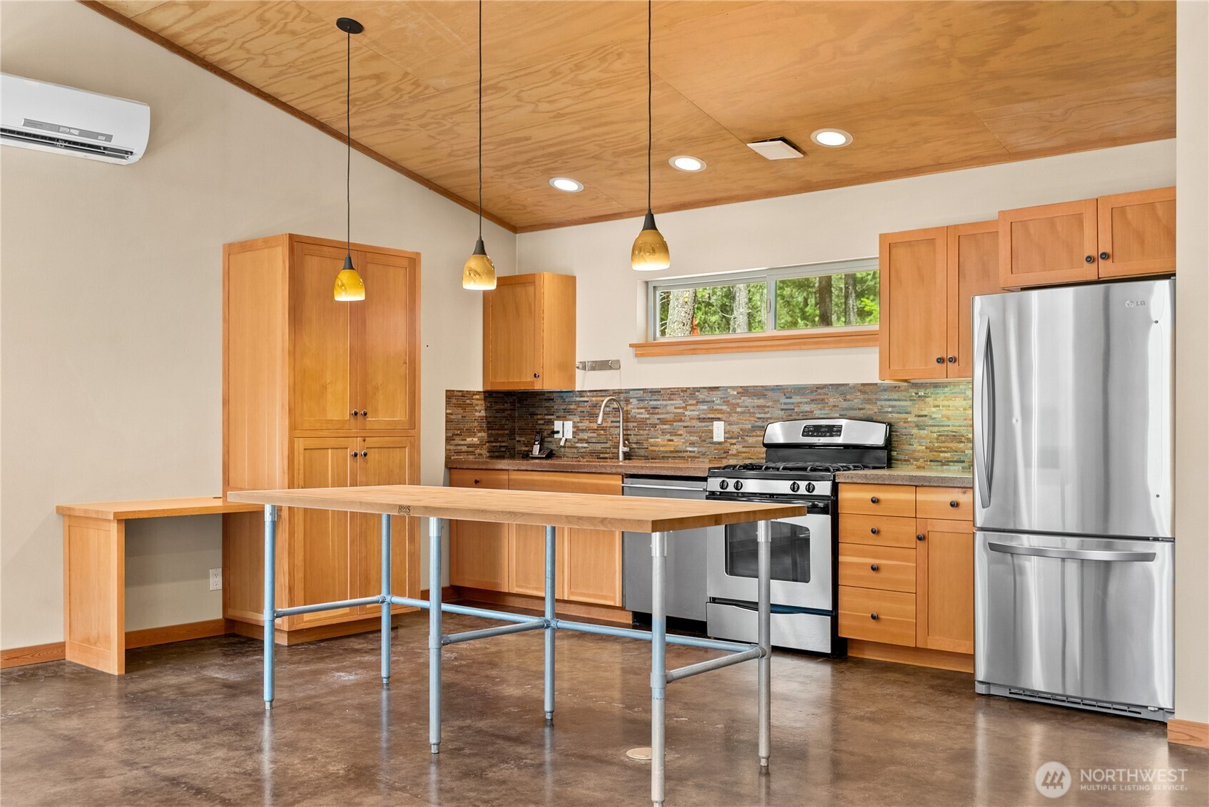 16 Littell Road Mazama, WA 98833 - Photo 9 of 40 a kitchen with stainless steel appliances granite countertop a stove and refrigerator