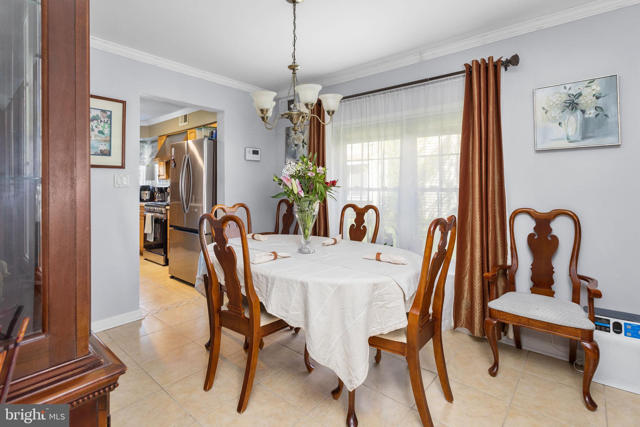 18 Geraldine Road East Windsor, NJ 08520 - Photo 11 of 42 a view of a dining room with furniture window and wooden floor