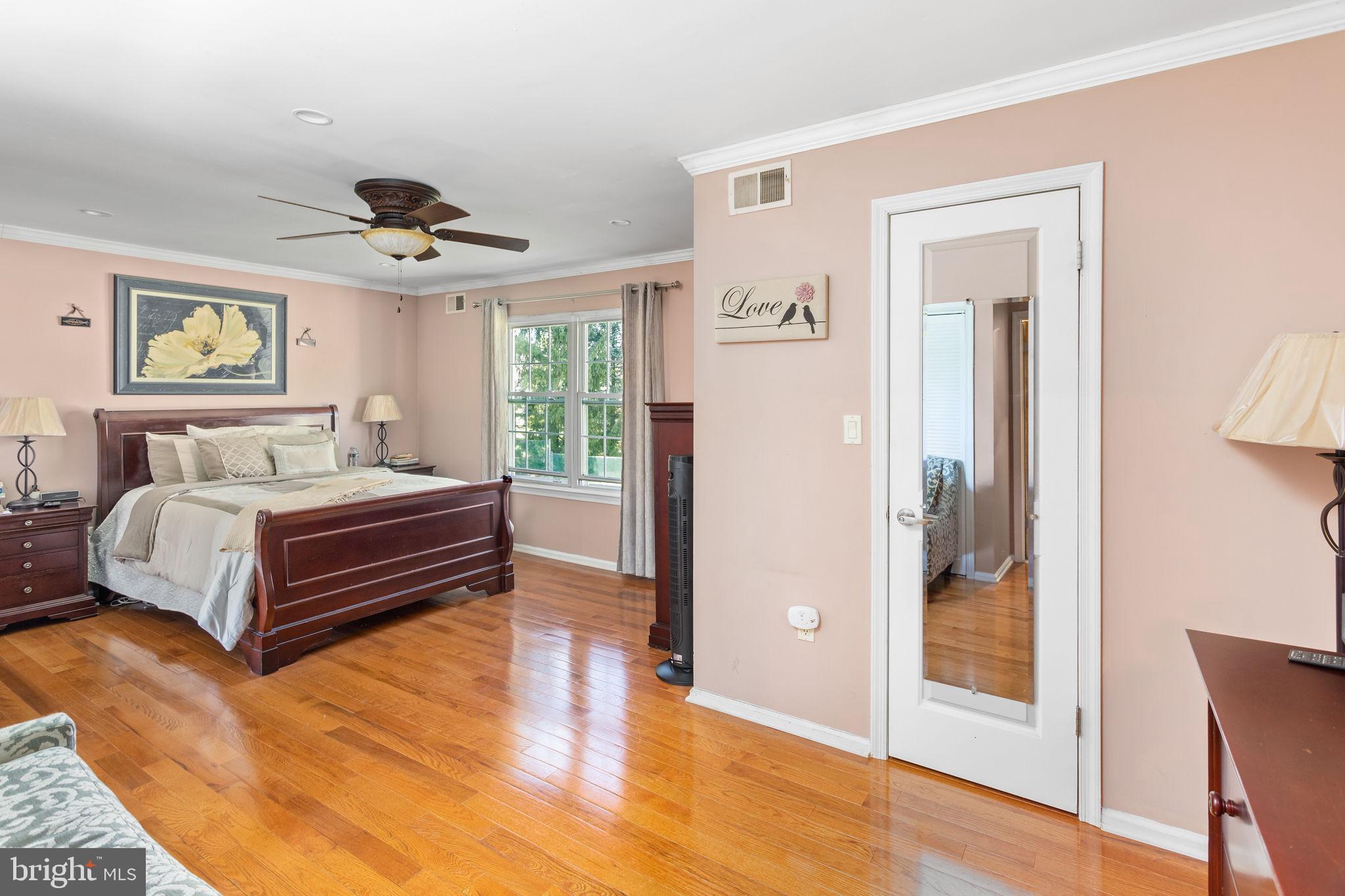 18 Geraldine Road East Windsor, NJ 08520 - Photo 24 of 42 a bedroom with a bed and wooden floor