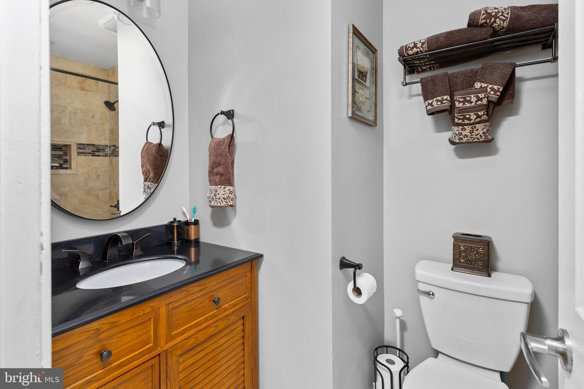 18 Geraldine Road East Windsor, NJ 08520 - Photo 33 of 42 a bathroom with a toilet a sink and mirror