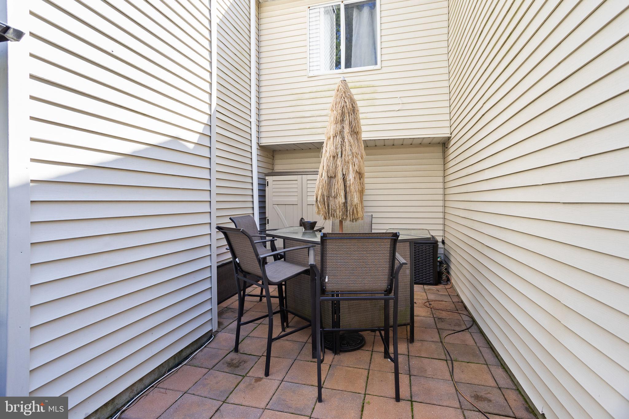18 Geraldine Road East Windsor, NJ 08520 - Photo 36 of 42 a view of a patio with table and chairs and wooden floor