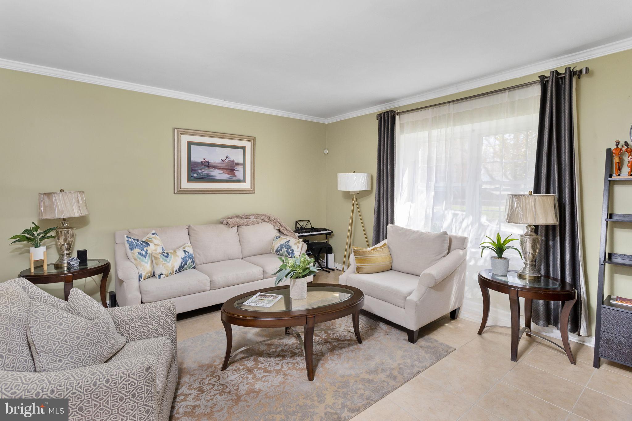 18 Geraldine Road East Windsor, NJ 08520 - Photo 6 of 42 a living room with furniture and a large window