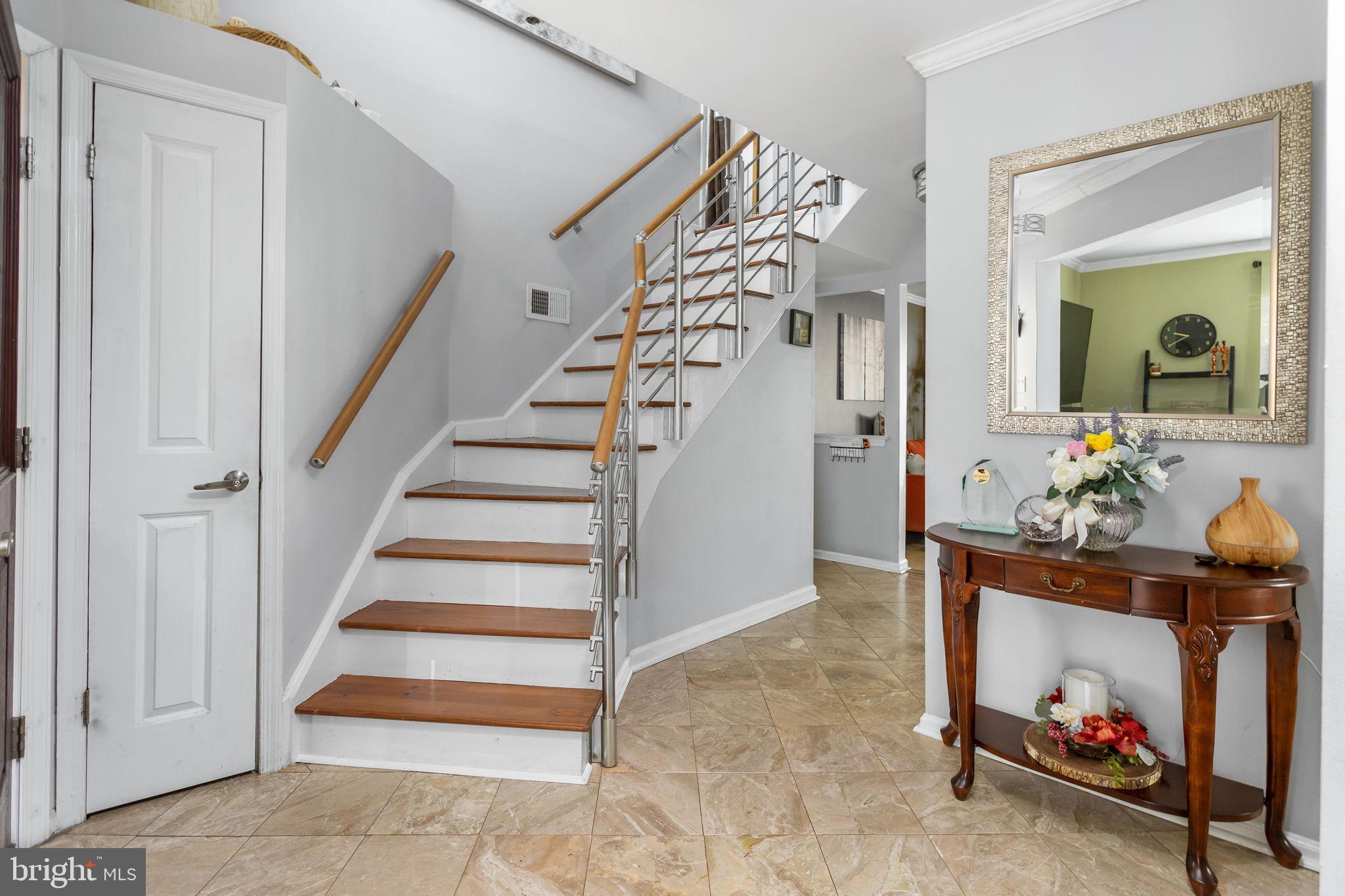 18 Geraldine Road East Windsor, NJ 08520 - Photo 8 of 42 a view of entryway with furniture and wooden floor