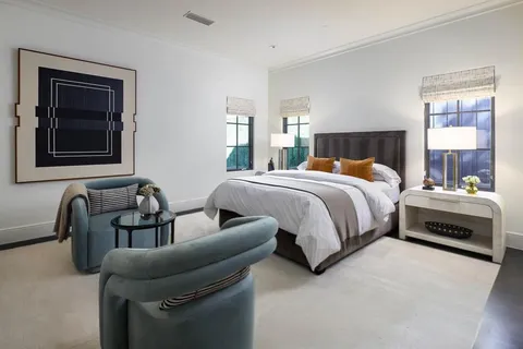 a bedroom with bed and a couch