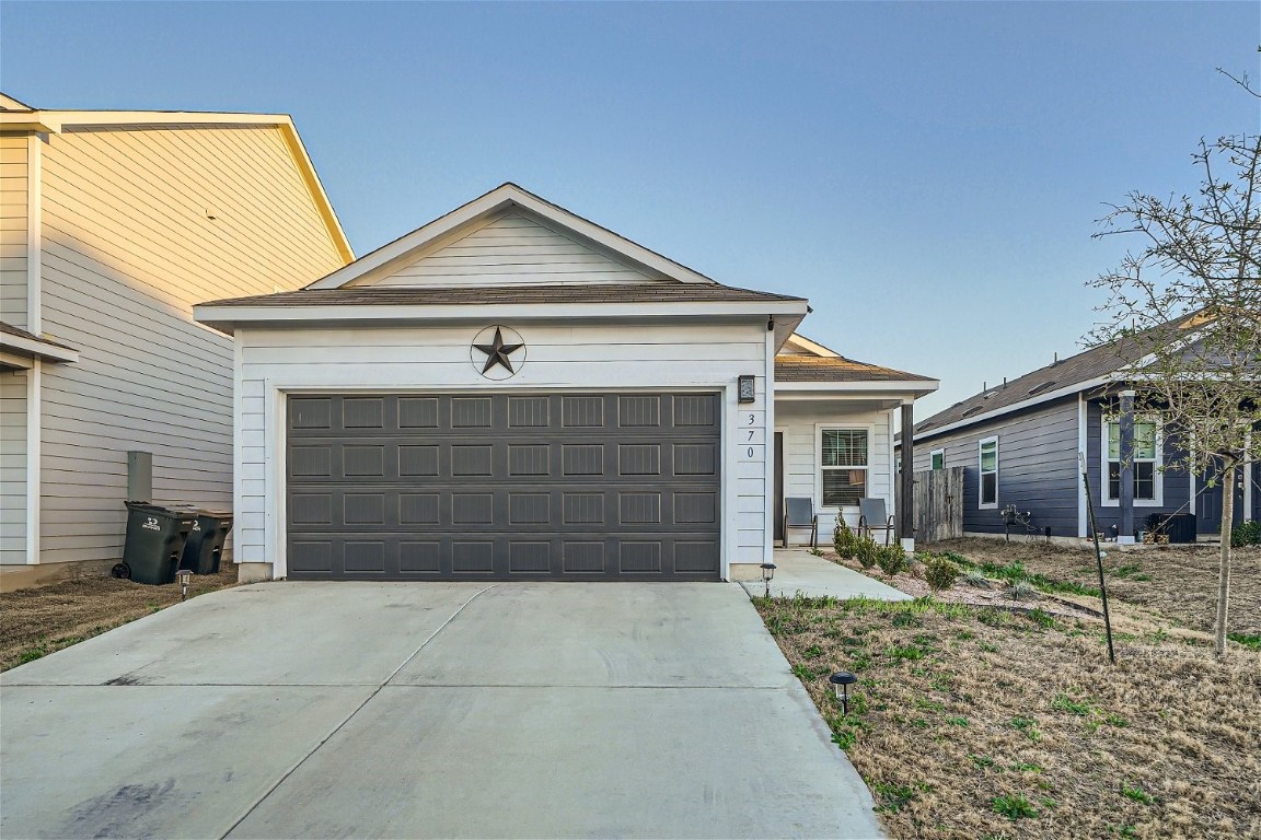 a front view of a house with a garage