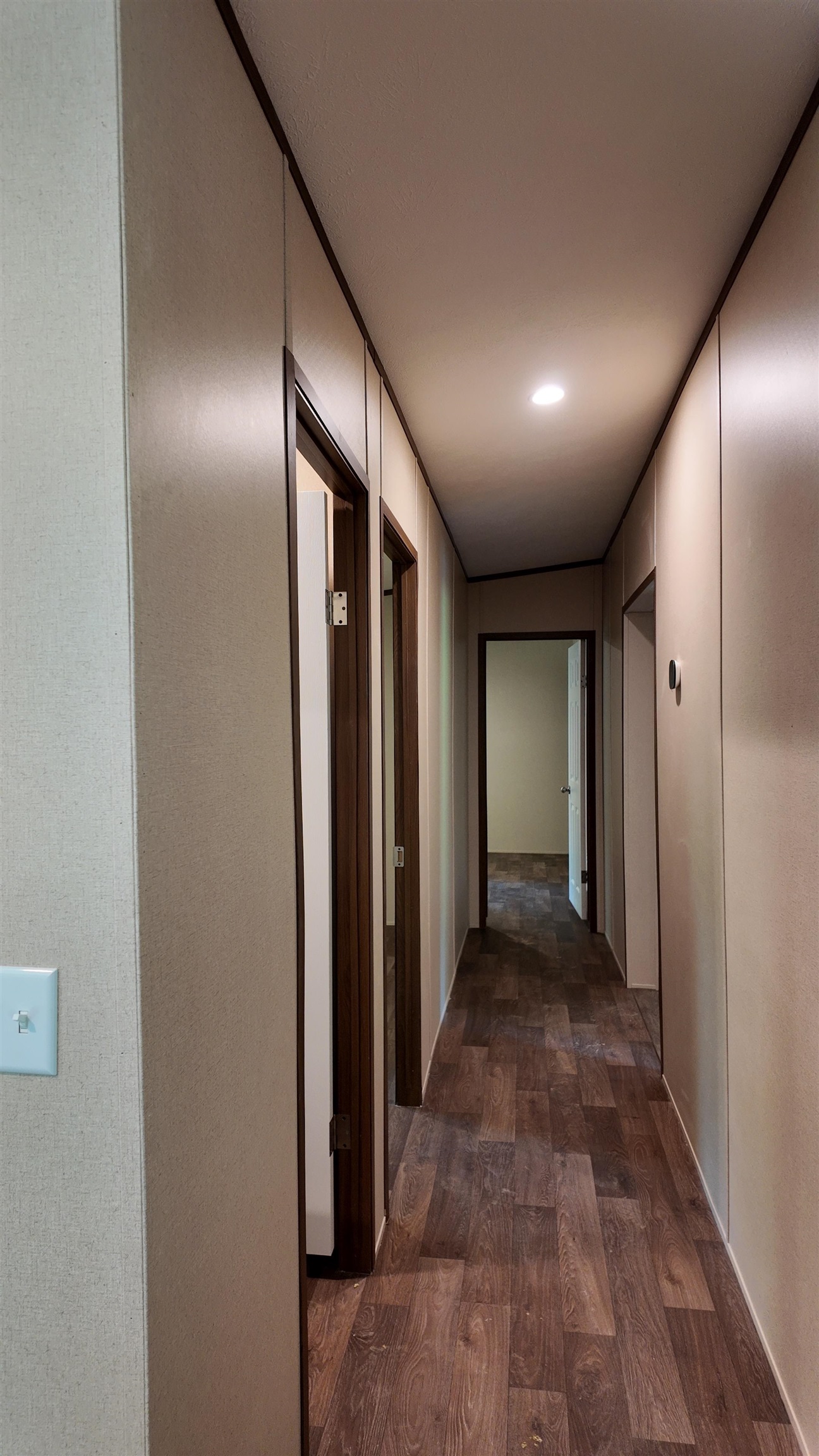 208 Marcy Cove Ripley, TN 38063 - Photo 11 of 14 Hallway featuring dark wood finished floors
