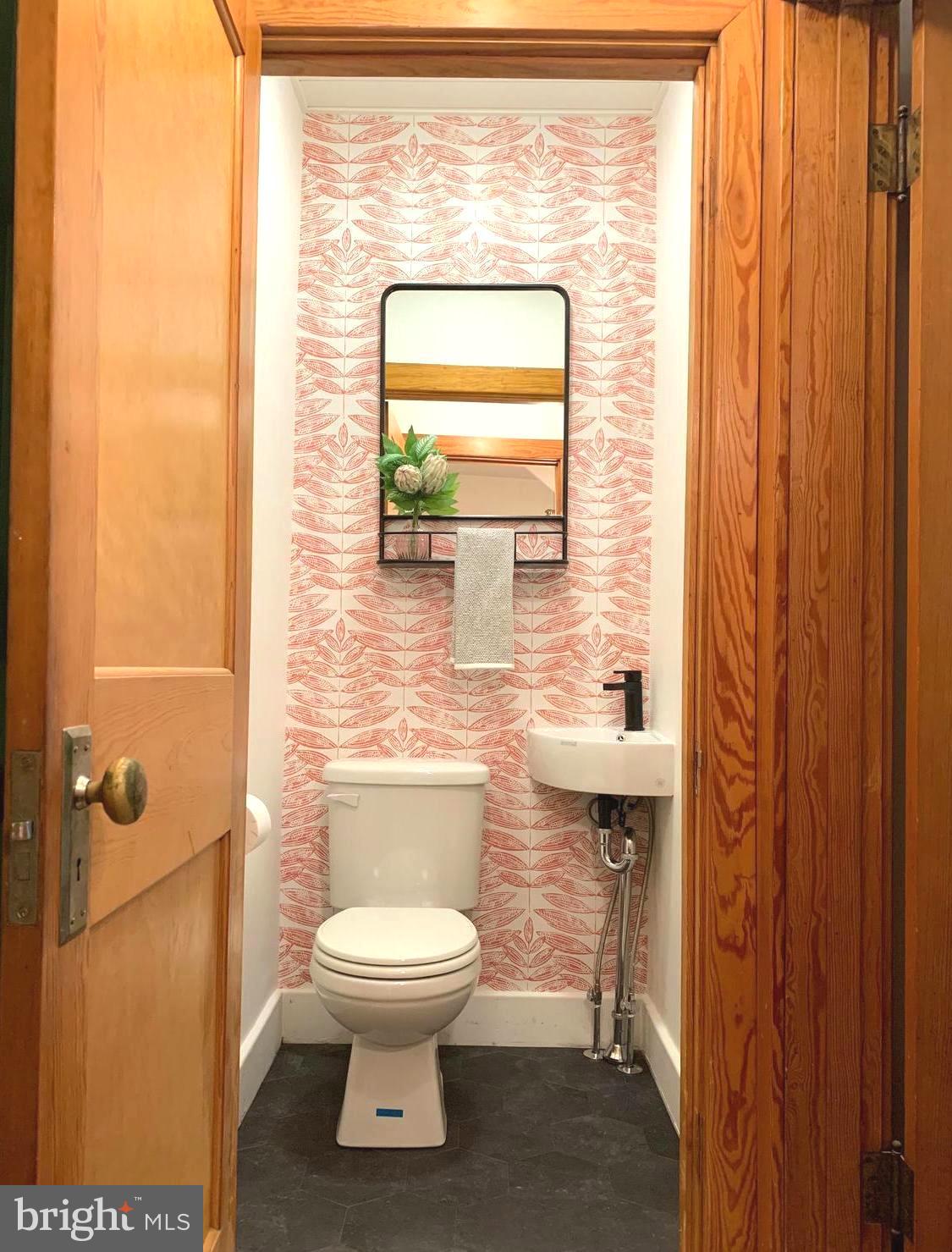46 West Main Street Lebanon, PA 17042 - Photo 14 of 33 a bathroom with a toilet a sink and a window