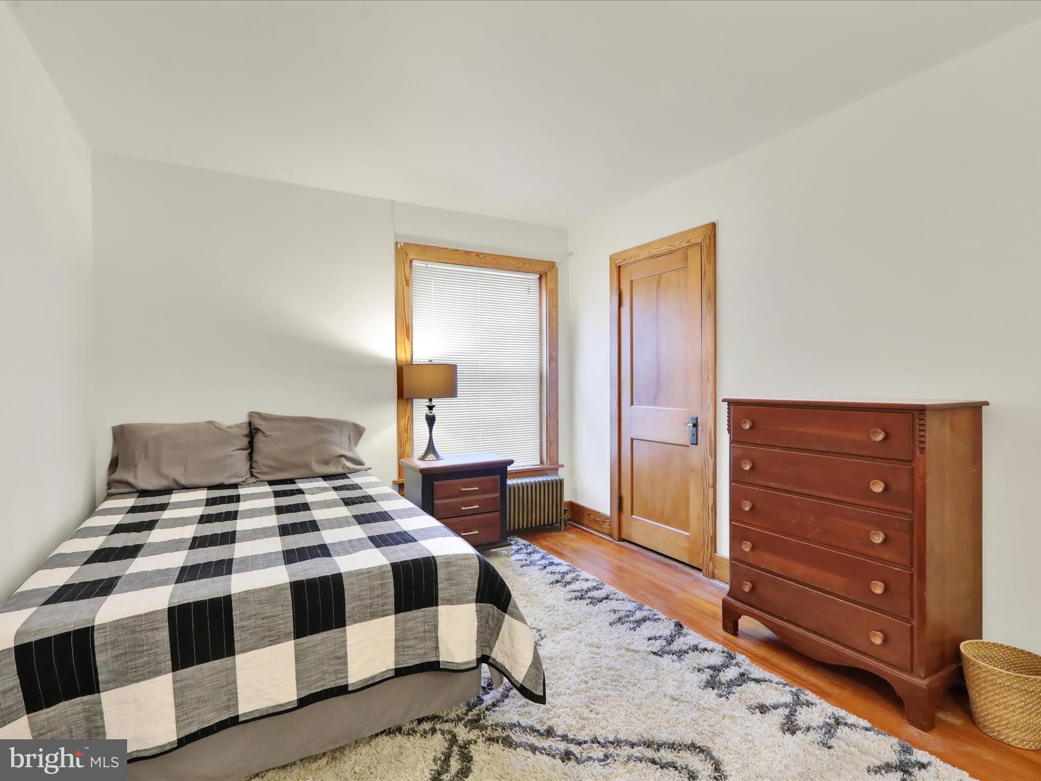 46 West Main Street Lebanon, PA 17042 - Photo 20 of 33 a bedroom with a bed and wooden floor